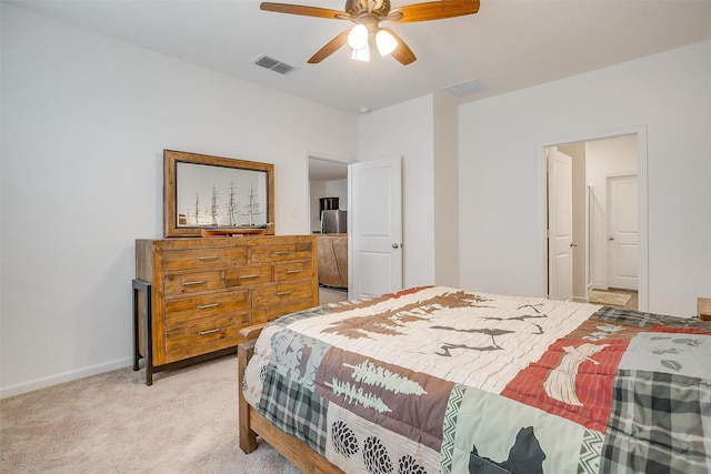 bedroom with visible vents, light carpet, baseboards, and ceiling fan