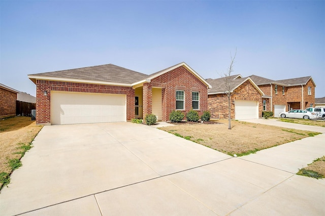 ranch-style home with concrete driveway, an attached garage, brick siding, and a shingled roof