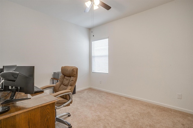 home office featuring baseboards, carpet, and a ceiling fan