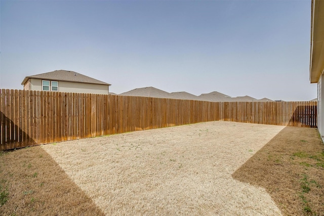 view of yard featuring a fenced backyard