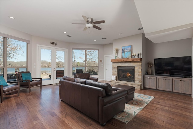 living area with visible vents, recessed lighting, a fireplace, and dark wood-style flooring