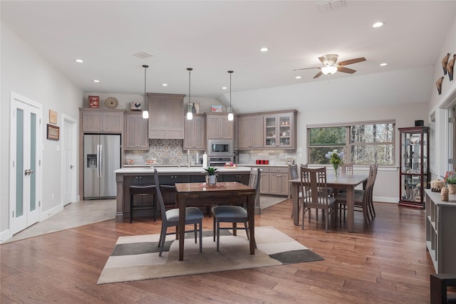 dining room with recessed lighting, visible vents, baseboards, and light wood-style flooring