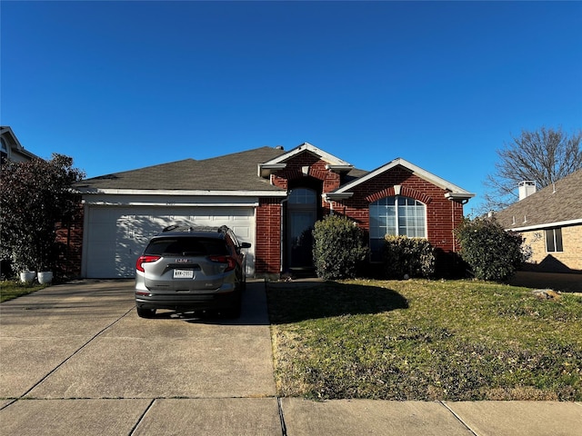 ranch-style house with brick siding, an attached garage, concrete driveway, and a front yard