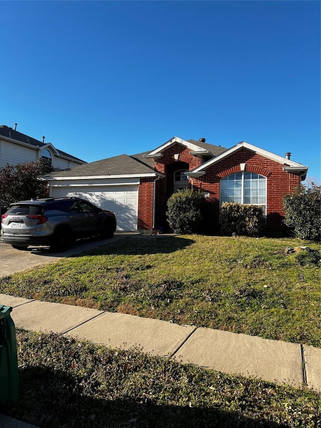 ranch-style home with brick siding, a front lawn, and a garage