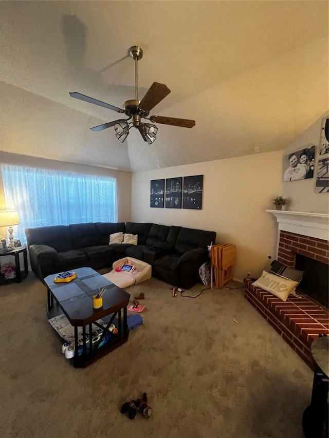 carpeted living area with lofted ceiling, a fireplace, and ceiling fan