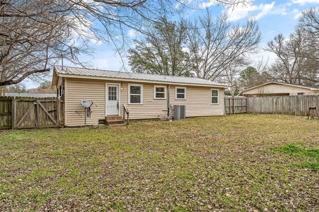 421 Murrey, Canton, TX 75103 - rear view of property featuring a gate, entry steps, a fenced backyard, a yard, and metal roof
