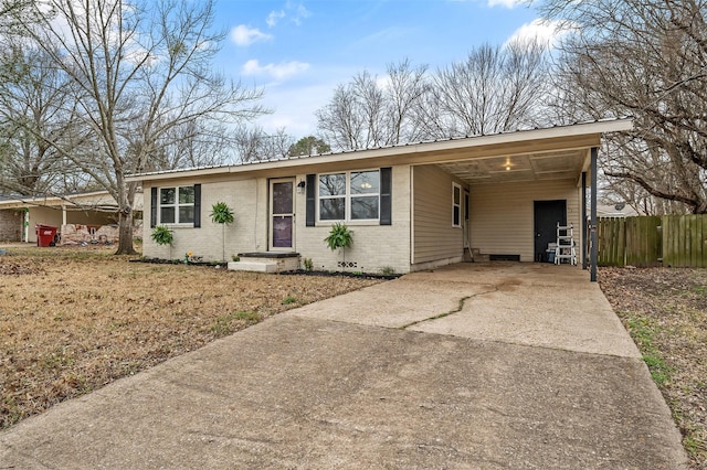421 Murrey, Canton, TX 75103 - single story home with brick siding, an attached carport, fence, concrete driveway, and metal roof