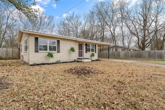 421 Murrey, Canton, TX 75103 - single story home featuring driveway, a carport, fence, metal roof, and brick siding