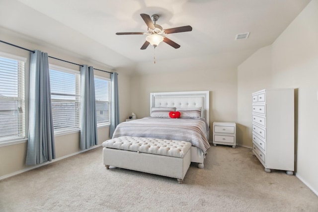 bedroom featuring visible vents, light carpet, baseboards, and ceiling fan