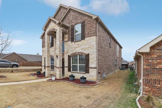 view of front of property with stone siding and brick siding