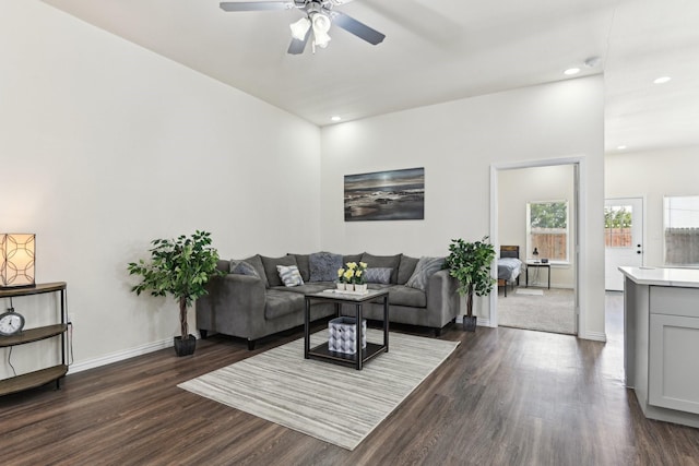 living room featuring recessed lighting, baseboards, ceiling fan, and dark wood-style flooring