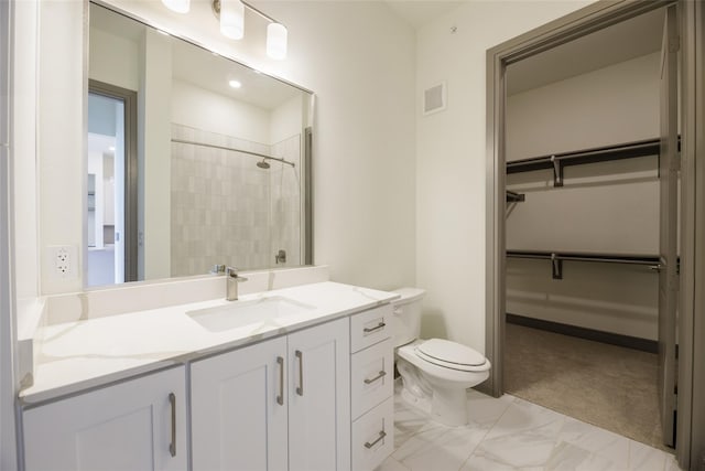 full bathroom featuring visible vents, a tile shower, a walk in closet, toilet, and marble finish floor