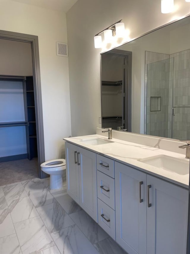 full bathroom with visible vents, marble finish floor, a stall shower, and a sink