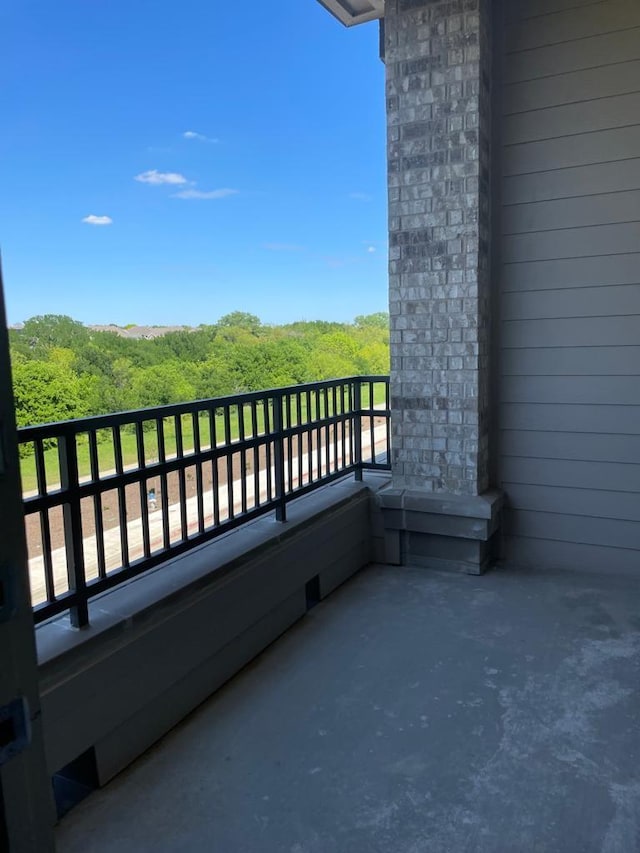 balcony with a wooded view