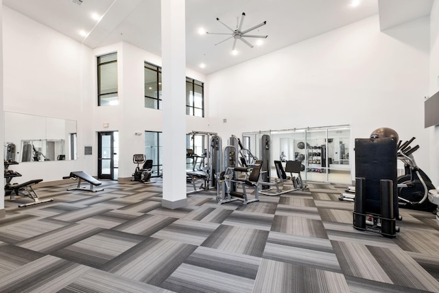 workout area featuring visible vents and carpet floors