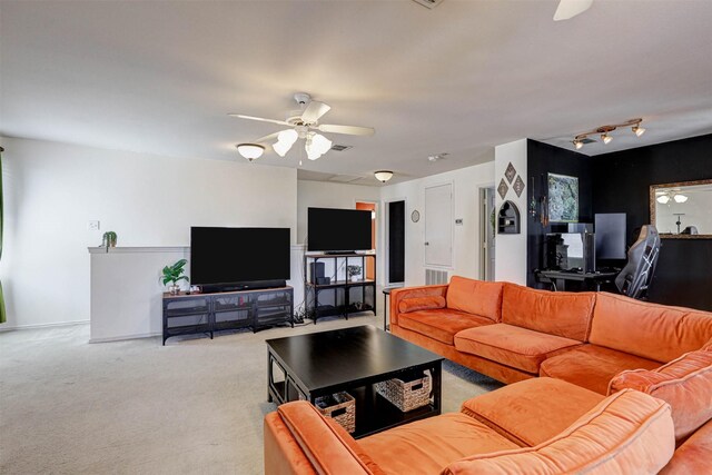 living room with light colored carpet and ceiling fan