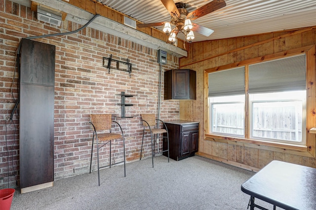 interior space with ceiling fan