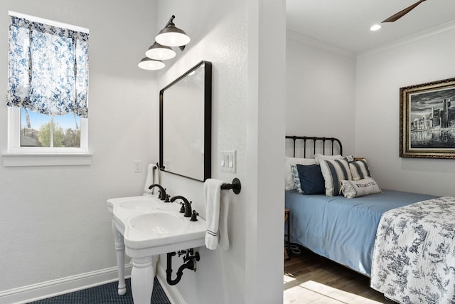 bedroom featuring recessed lighting, wood finished floors, baseboards, and ornamental molding