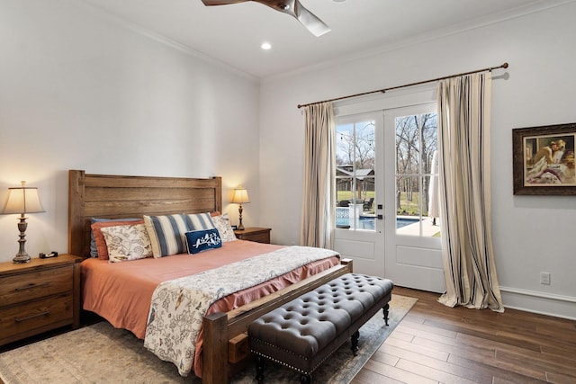 bedroom featuring wood finished floors, french doors, crown molding, baseboards, and access to exterior