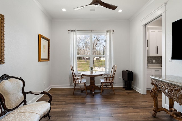 dining room with dark wood finished floors, recessed lighting, crown molding, baseboards, and ceiling fan