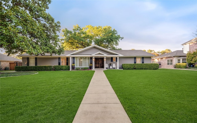 ranch-style home with a front yard