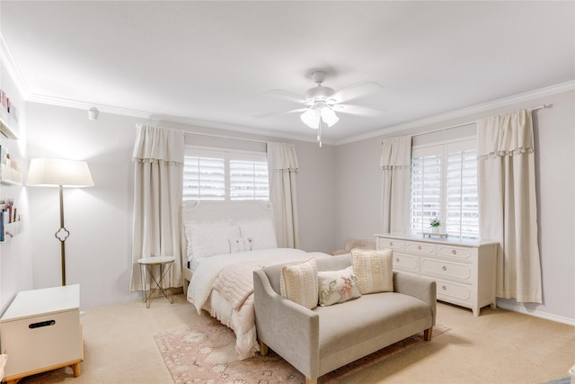 bedroom featuring light colored carpet, a ceiling fan, and ornamental molding