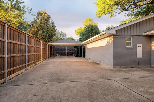 view of home's exterior with fence and brick siding