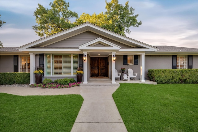 view of front of home with a front yard and brick siding