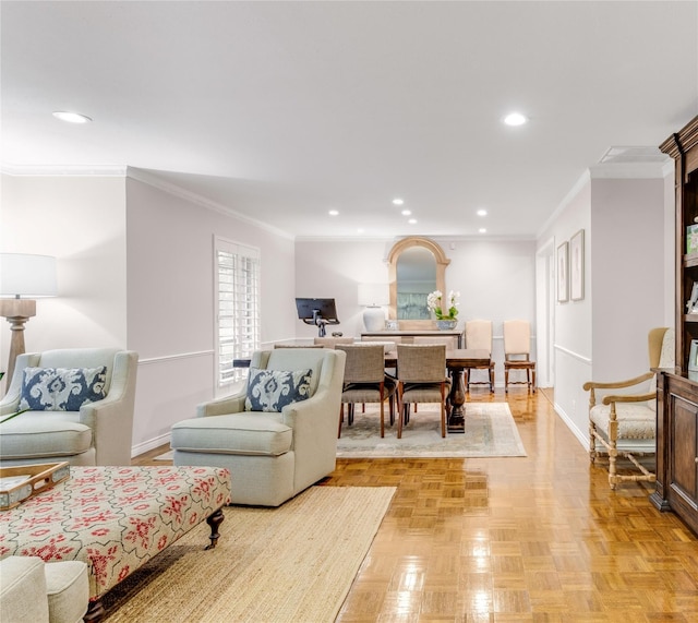 living room with crown molding, recessed lighting, and baseboards