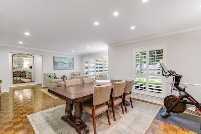 dining room featuring recessed lighting and ornamental molding