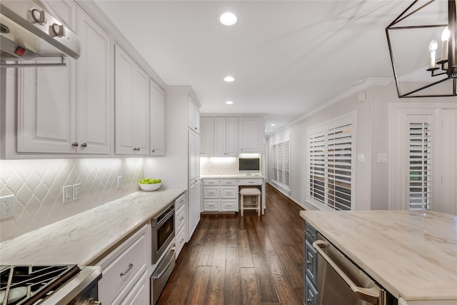 kitchen with recessed lighting, appliances with stainless steel finishes, white cabinets, decorative backsplash, and dark wood-style flooring