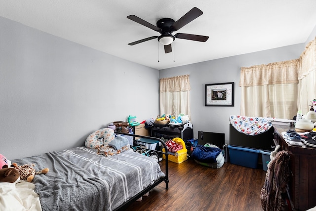 bedroom with a ceiling fan and wood finished floors