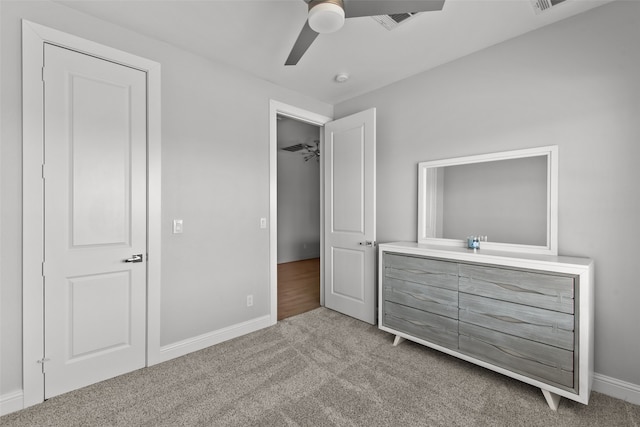 bedroom featuring carpet flooring, ceiling fan, visible vents, and baseboards