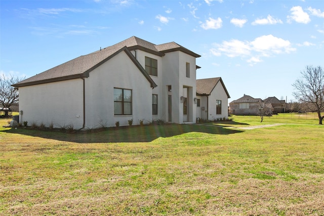 view of home's exterior featuring a lawn