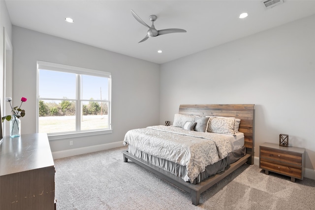 carpeted bedroom featuring recessed lighting, visible vents, baseboards, and ceiling fan