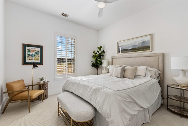 bedroom featuring ceiling fan, baseboards, visible vents, and light carpet