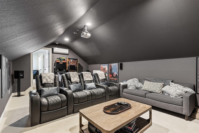 cinema room with a wall unit AC, baseboards, vaulted ceiling, a textured ceiling, and light colored carpet