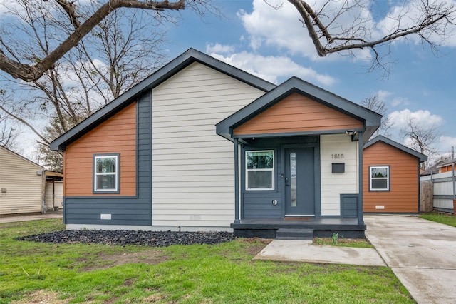 bungalow-style home with crawl space and a front yard