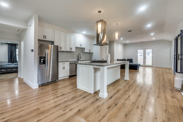 1818 Engle Ave, Dallas, TX 75224 - kitchen featuring stainless steel appliances, open floor plan, recessed lighting, a sink, and light wood-style floors