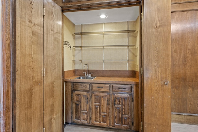 bar with a sink and indoor wet bar