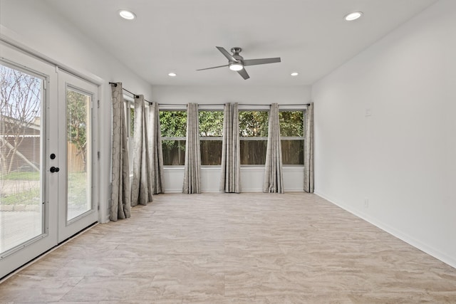 unfurnished sunroom with french doors and ceiling fan