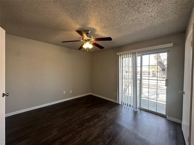 unfurnished room featuring baseboards, a textured ceiling, and dark wood-style floors