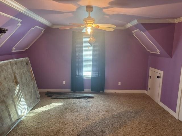 bonus room featuring lofted ceiling, a ceiling fan, baseboards, and carpet floors