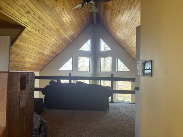 bonus room with ceiling fan, carpet, beamed ceiling, wooden ceiling, and high vaulted ceiling