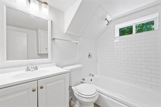 bathroom with shower / bathtub combination, toilet, vanity, and vaulted ceiling