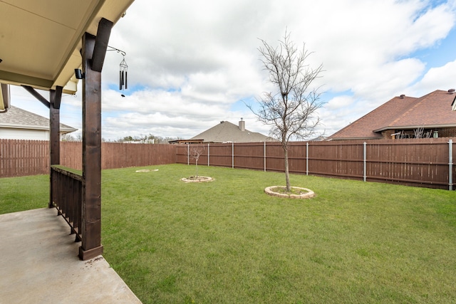 view of yard with a fenced backyard