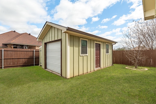 view of outbuilding with a fenced backyard and an outdoor structure