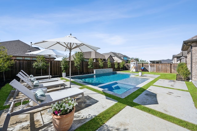 view of swimming pool with a patio area, a fenced in pool, a yard, and a fenced backyard