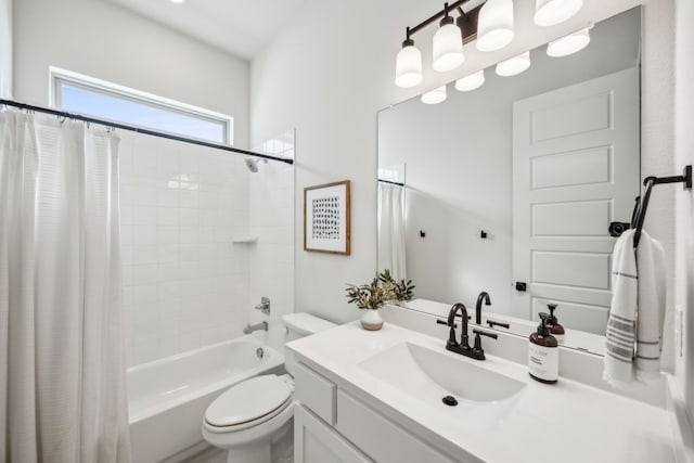 full bathroom with vanity, toilet, and shower / tub combo with curtain