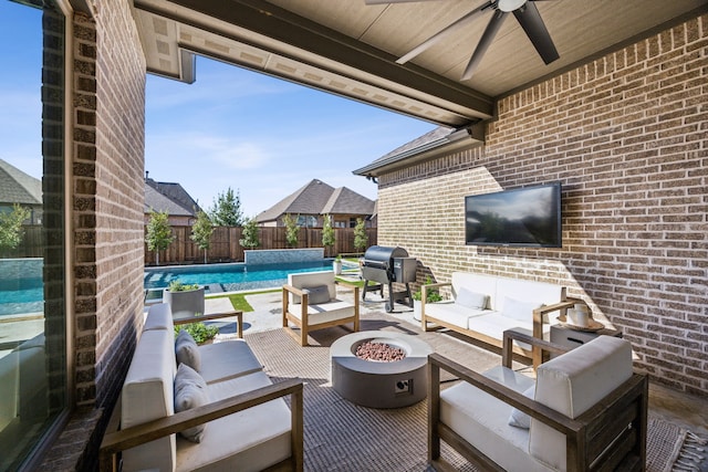 view of patio with a fenced in pool, an outdoor living space with a fire pit, a fenced backyard, area for grilling, and a ceiling fan